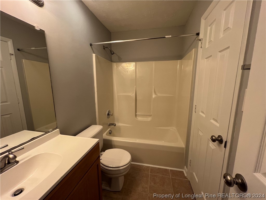 3375 Galleria Drive, Unit 17 Fayetteville, NC 28303 - Photo 17 of 19 a bathroom with a sink a toilet and shower