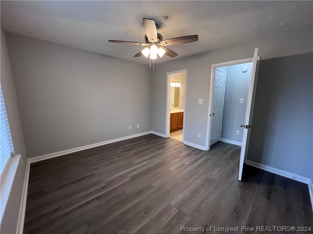 3375 Galleria Drive, Unit 17 Fayetteville, NC 28303 - Photo 10 of 19 an empty room with wooden floor and ceiling fan