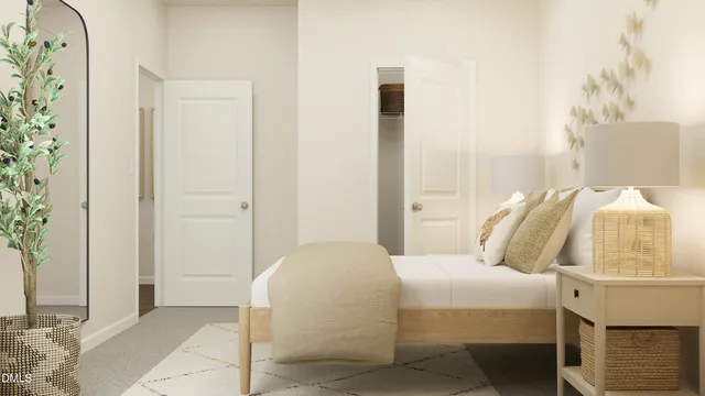 a bedroom with a bed and a mirror