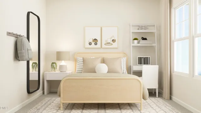 a bedroom with a large bed and a window