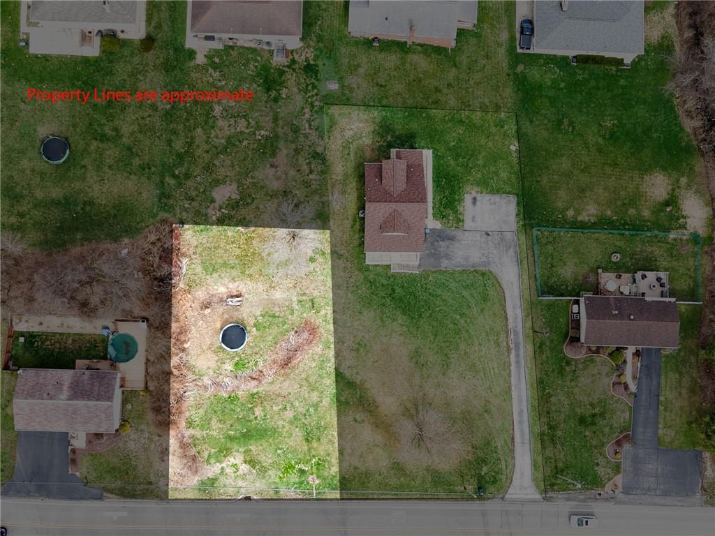 an aerial view of a house with outdoor space