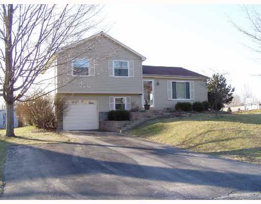 Exterior Front. Lovingly maintained multi level on flat lot on a cul-de-sac street