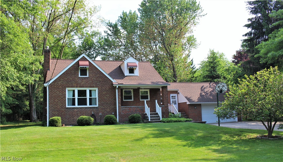 5944 Highland Road Cleveland, OH 44143 - Photo 1 of 20 All brick Cape Cod home on 1.57 wooded and landscaped acres.