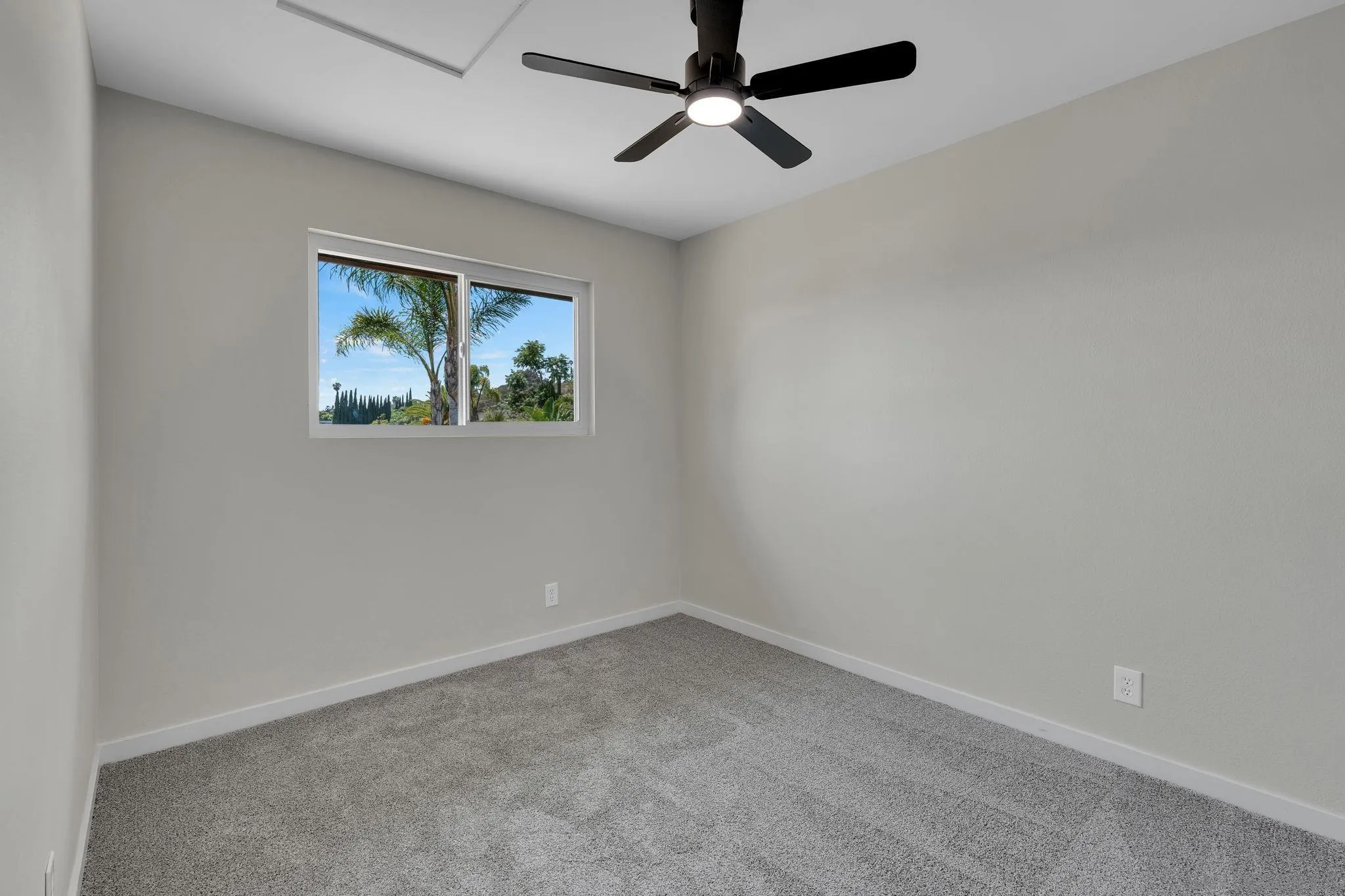13322 Via Mark Poway, CA 92064 - Photo 18 of 25 an empty room with a window and a ceiling fan