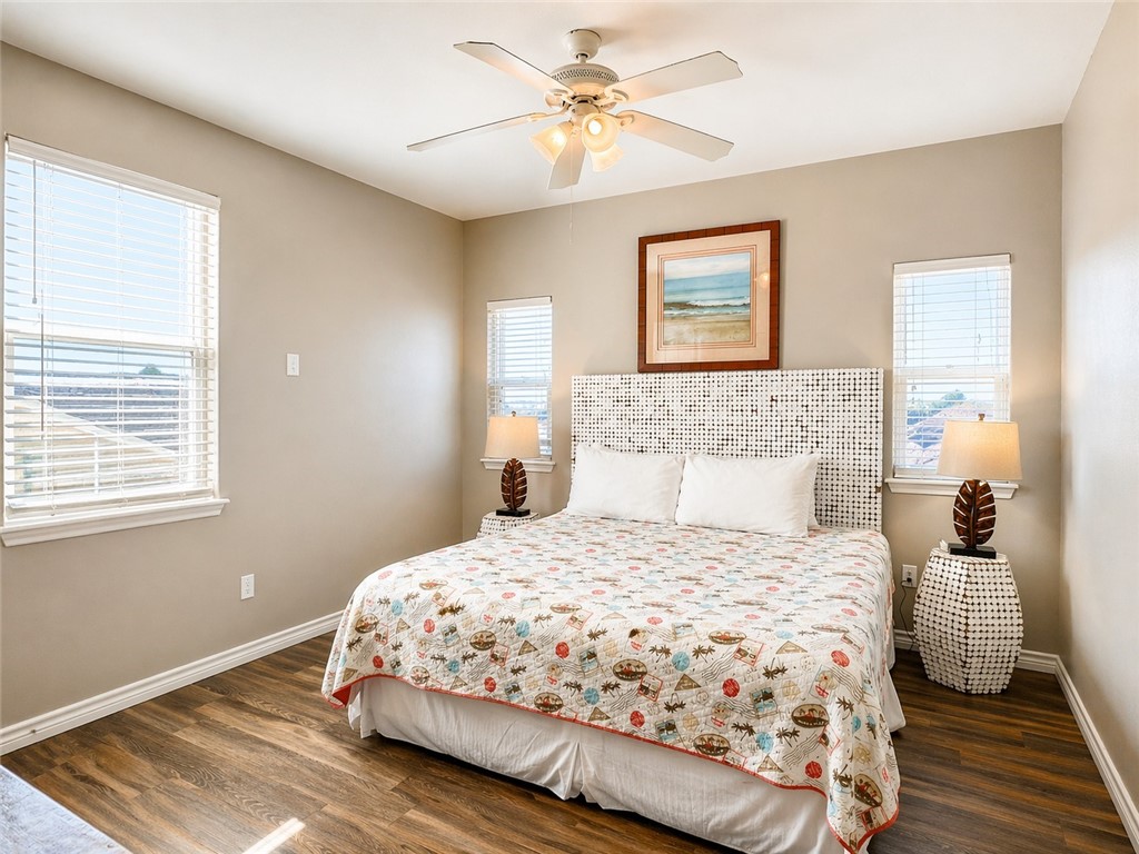 14916 Packery View Loop Corpus Christi, TX 78418 - Photo 15 of 32 a bedroom with a bed and wooden floor