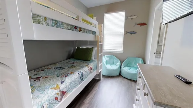 a bedroom with bed and window