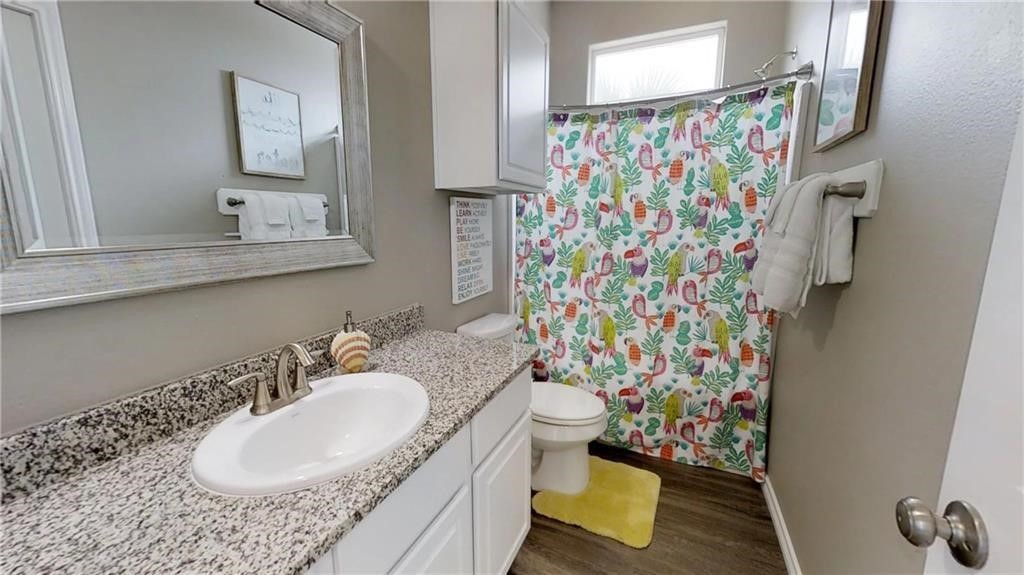 14916 Packery View Loop Corpus Christi, TX 78418 - Photo 19 of 32 a bathroom with a granite countertop sink and a mirror