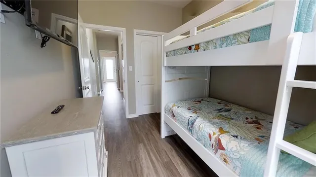 a bed room with a bed and a window