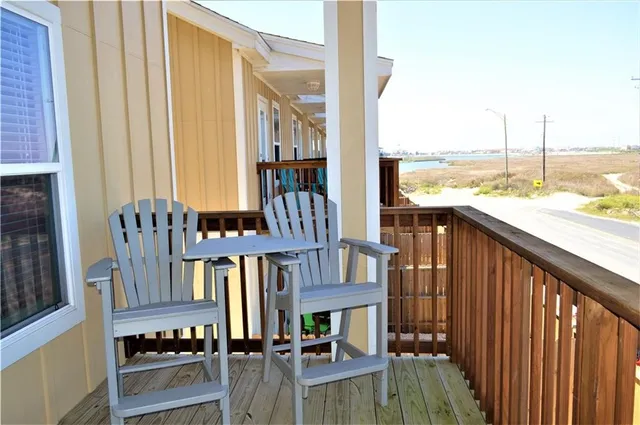 a view of a balcony with chairs