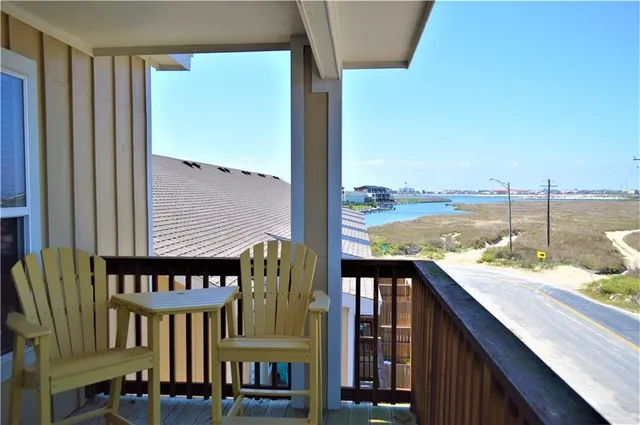 a view of a balcony with an ocean view