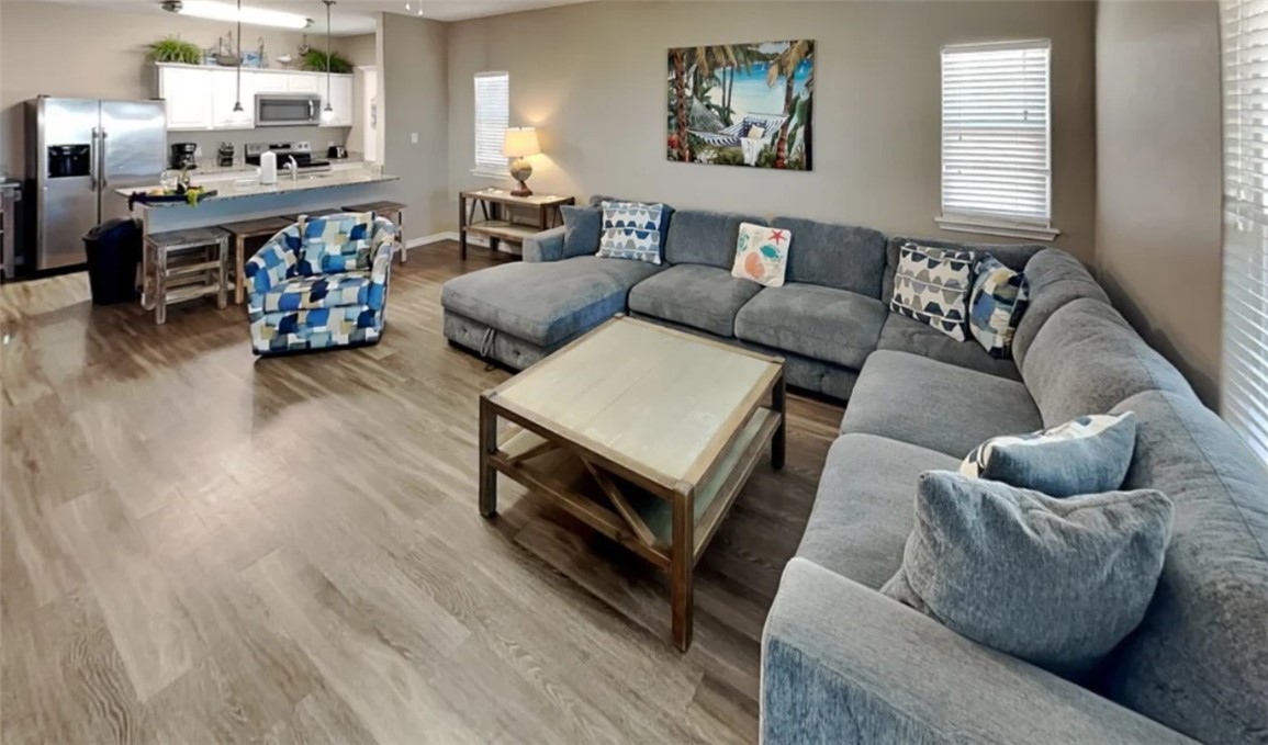 14916 Packery View Loop Corpus Christi, TX 78418 - Photo 4 of 32 a living room with furniture and wooden floor