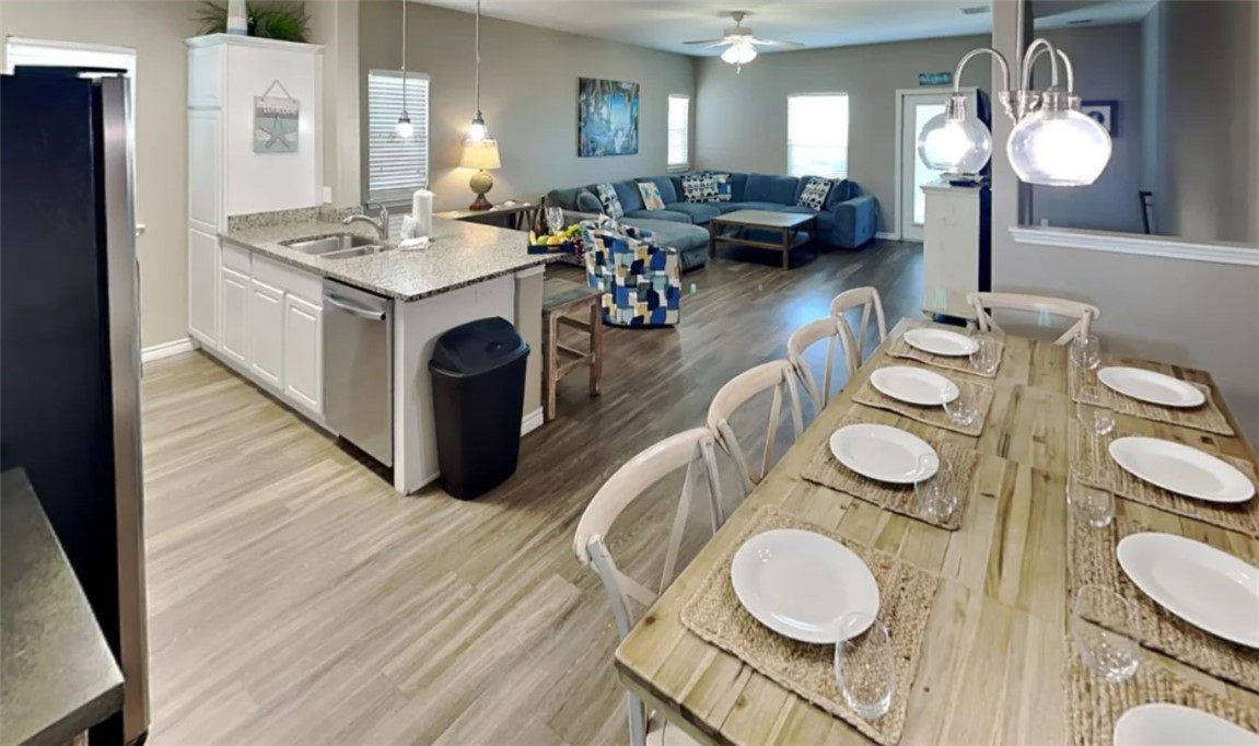 14916 Packery View Loop Corpus Christi, TX 78418 - Photo 5 of 32 a view of a dining room with furniture and wooden floor