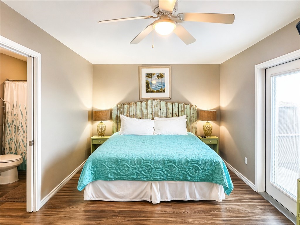 14916 Packery View Loop Corpus Christi, TX 78418 - Photo 9 of 32 a bedroom with a bed and wooden floor