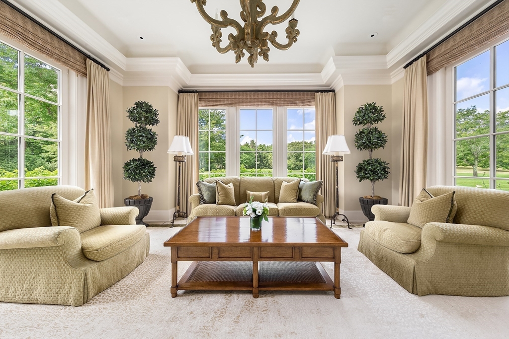 180 Ash Street Weston, MA 02493 - Photo 12 of 39 a living room with furniture and a large window