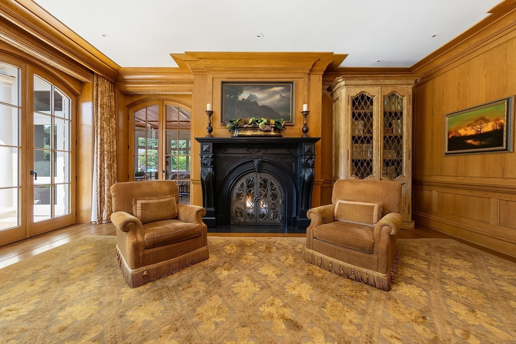 180 Ash Street Weston, MA 02493 - Photo 14 of 39 a living room with furniture and a fireplace