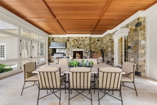 a view of a patio with a table and chairs