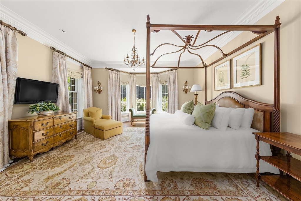 180 Ash Street Weston, MA 02493 - Photo 18 of 39 a bedroom with a large bed and a flat screen tv