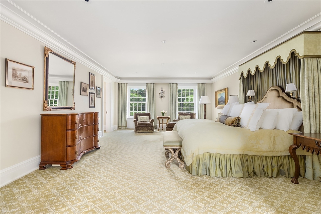 180 Ash Street Weston, MA 02493 - Photo 19 of 39 a spacious bedroom with a bed and large windows