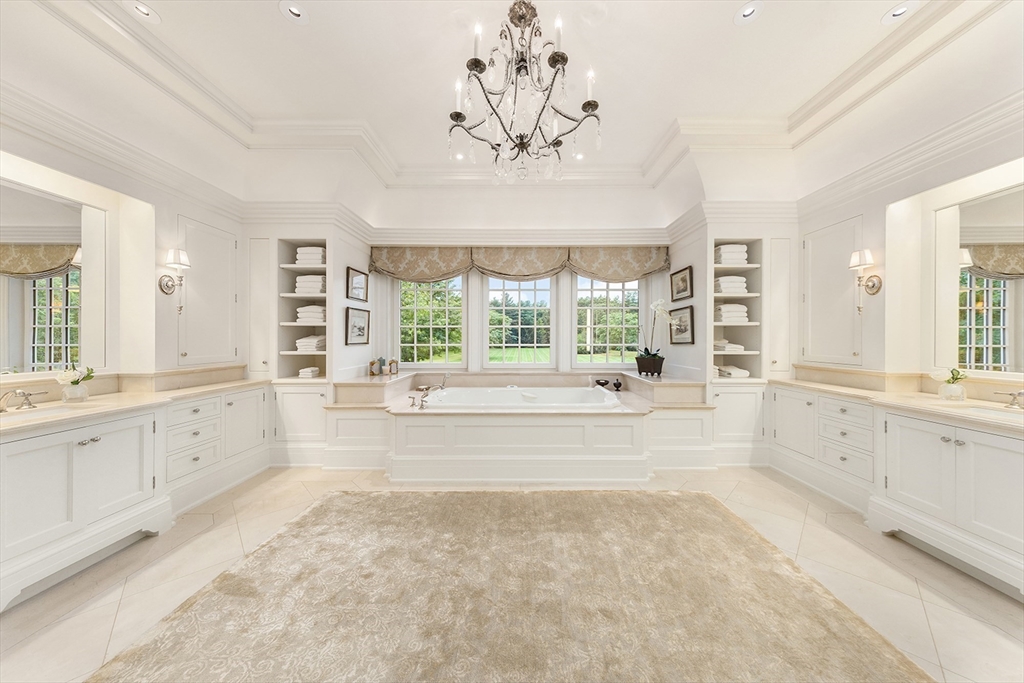 180 Ash Street Weston, MA 02493 - Photo 20 of 39 a spacious bathroom with a large tub sink and window