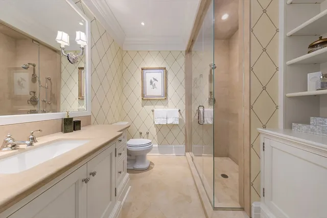 a spacious bathroom with a sink a toilet and shower