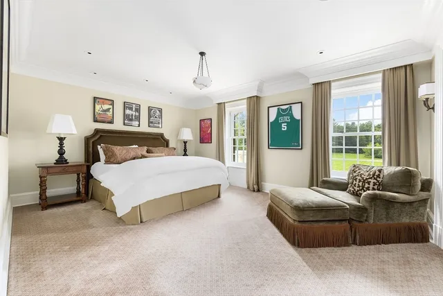 a bedroom with a bed and couch