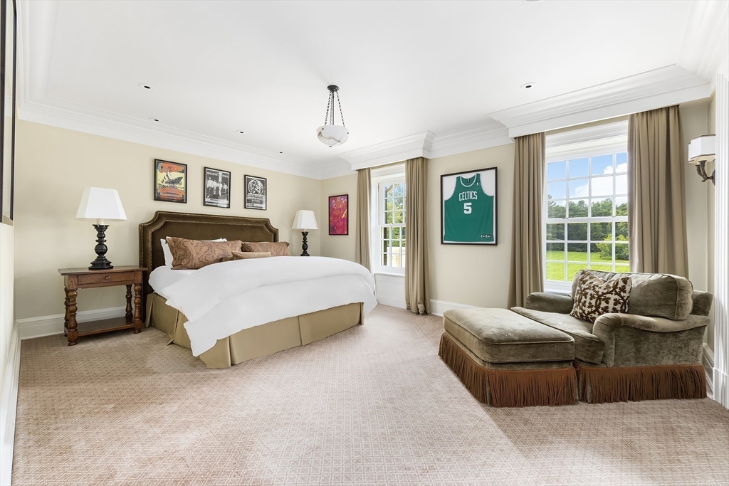 180 Ash Street Weston, MA 02493 - Photo 28 of 39 a bedroom with a bed and couch