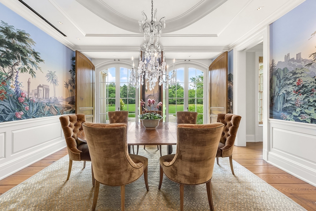 180 Ash Street Weston, MA 02493 - Photo 8 of 39 a view of a dining room with furniture wooden floor and chandelier