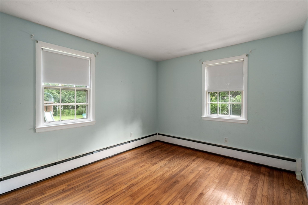 62 Nelson Place Worcester, MA 01605 - Photo 17 of 33 a view of an empty room with wooden floor and a window