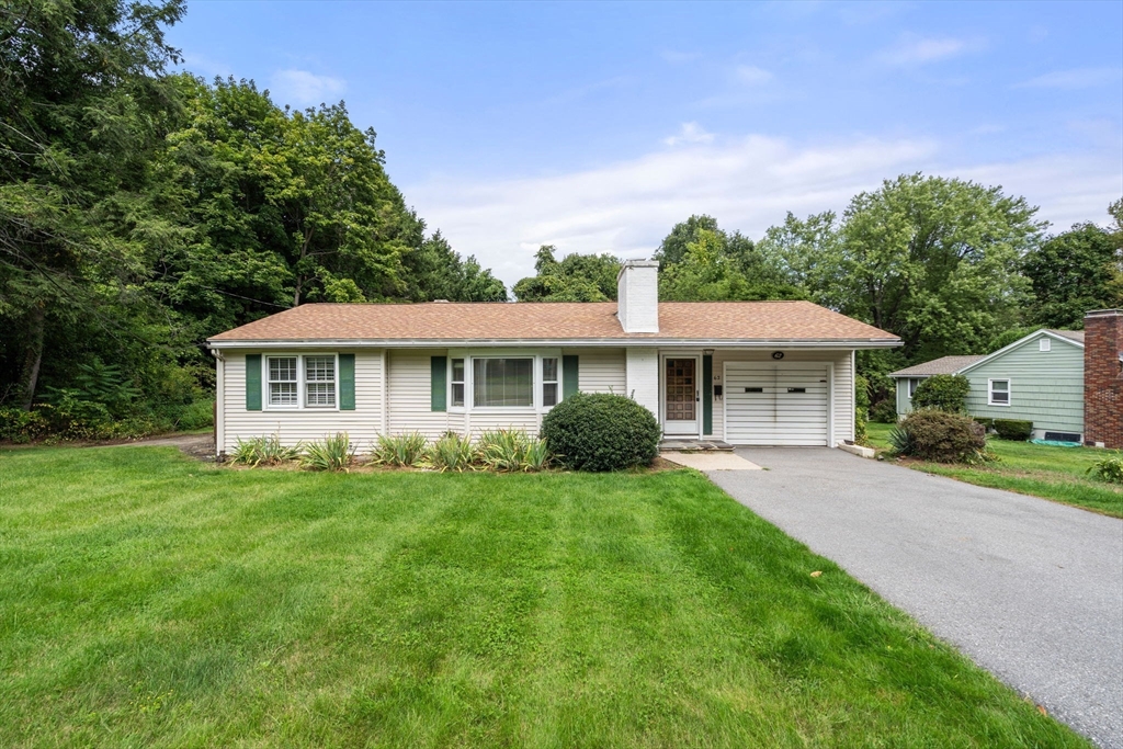 62 Nelson Place Worcester, MA 01605 - Photo 2 of 33 a front view of a house with a yard