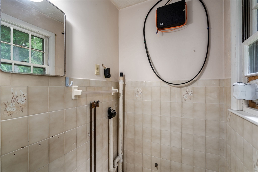 62 Nelson Place Worcester, MA 01605 - Photo 21 of 33 a bathroom with a sink and a mirror