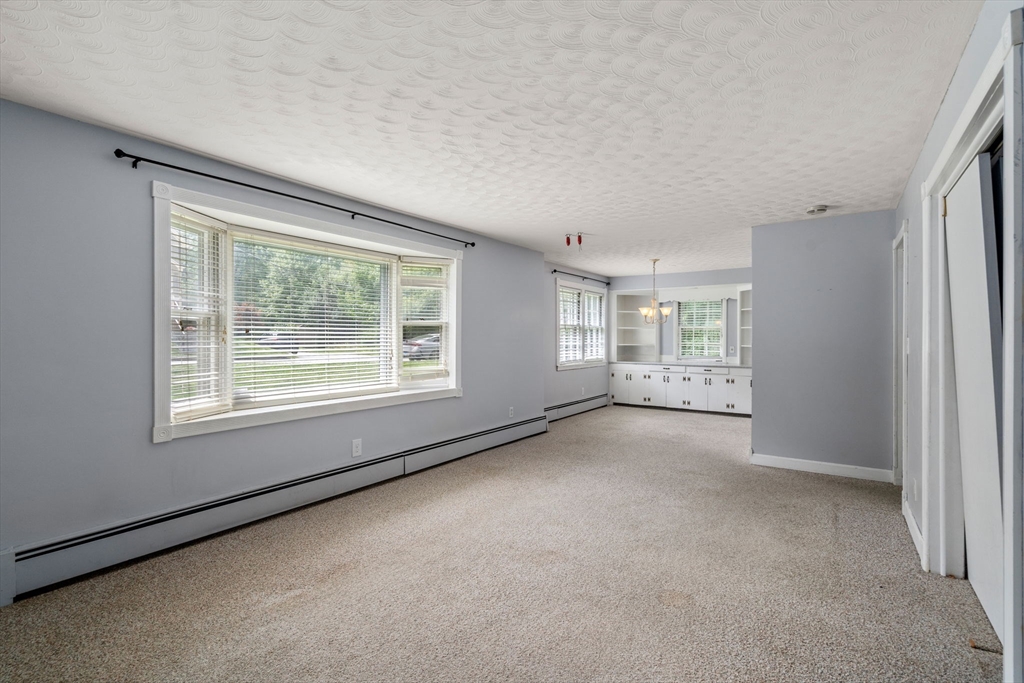 62 Nelson Place Worcester, MA 01605 - Photo 4 of 33 an empty room with windows