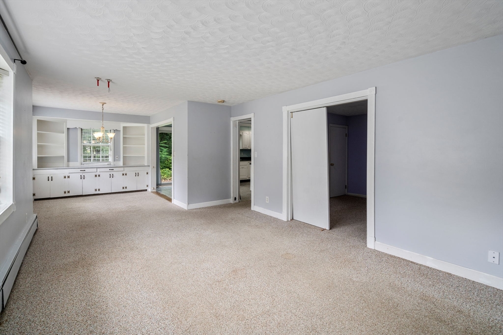 62 Nelson Place Worcester, MA 01605 - Photo 5 of 33 an empty room with a empty space and windows