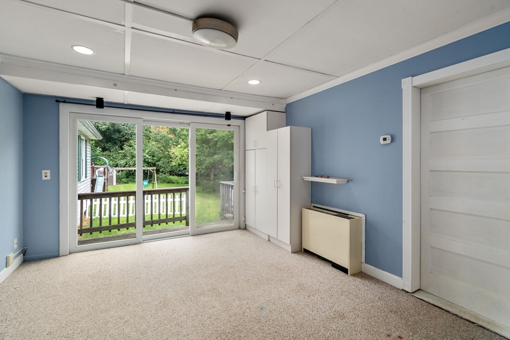 62 Nelson Place Worcester, MA 01605 - Photo 6 of 33 a view of an empty room with a floor to ceiling window and stairs