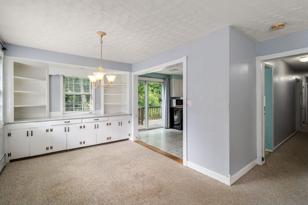 62 Nelson Place Worcester, MA 01605 - Photo 9 of 33 a view of an empty room with window cabinet and windows