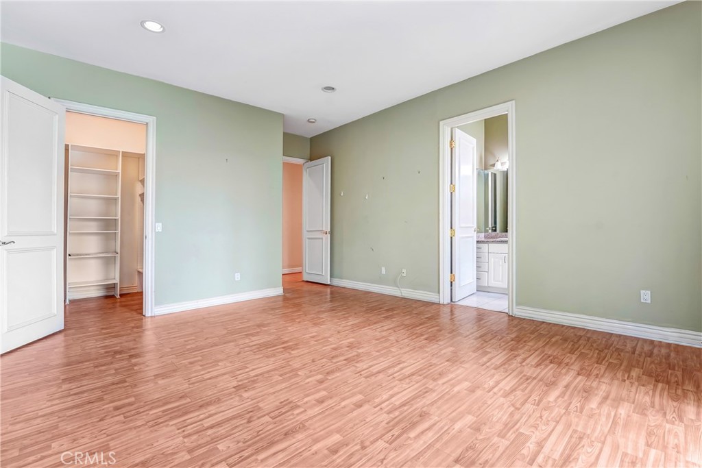17919 Califa Street Encino, CA 91316 - Photo 9 of 11 a view of an empty room with wooden floor and a window