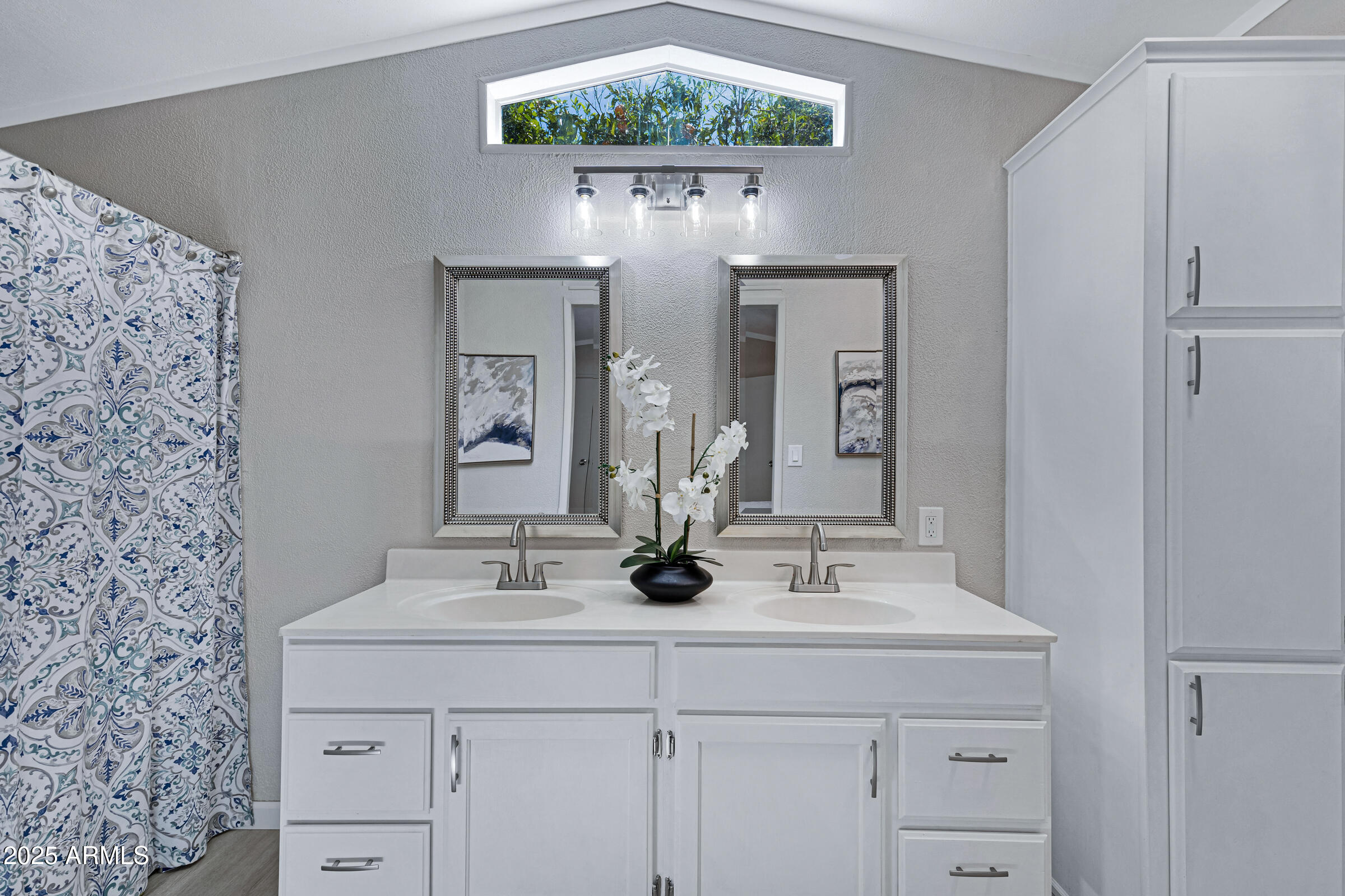 834 South Meridian Road, Unit 156 Apache Junction, AZ 85120 - Photo 11 of 20 a bathroom with a sink and a mirror