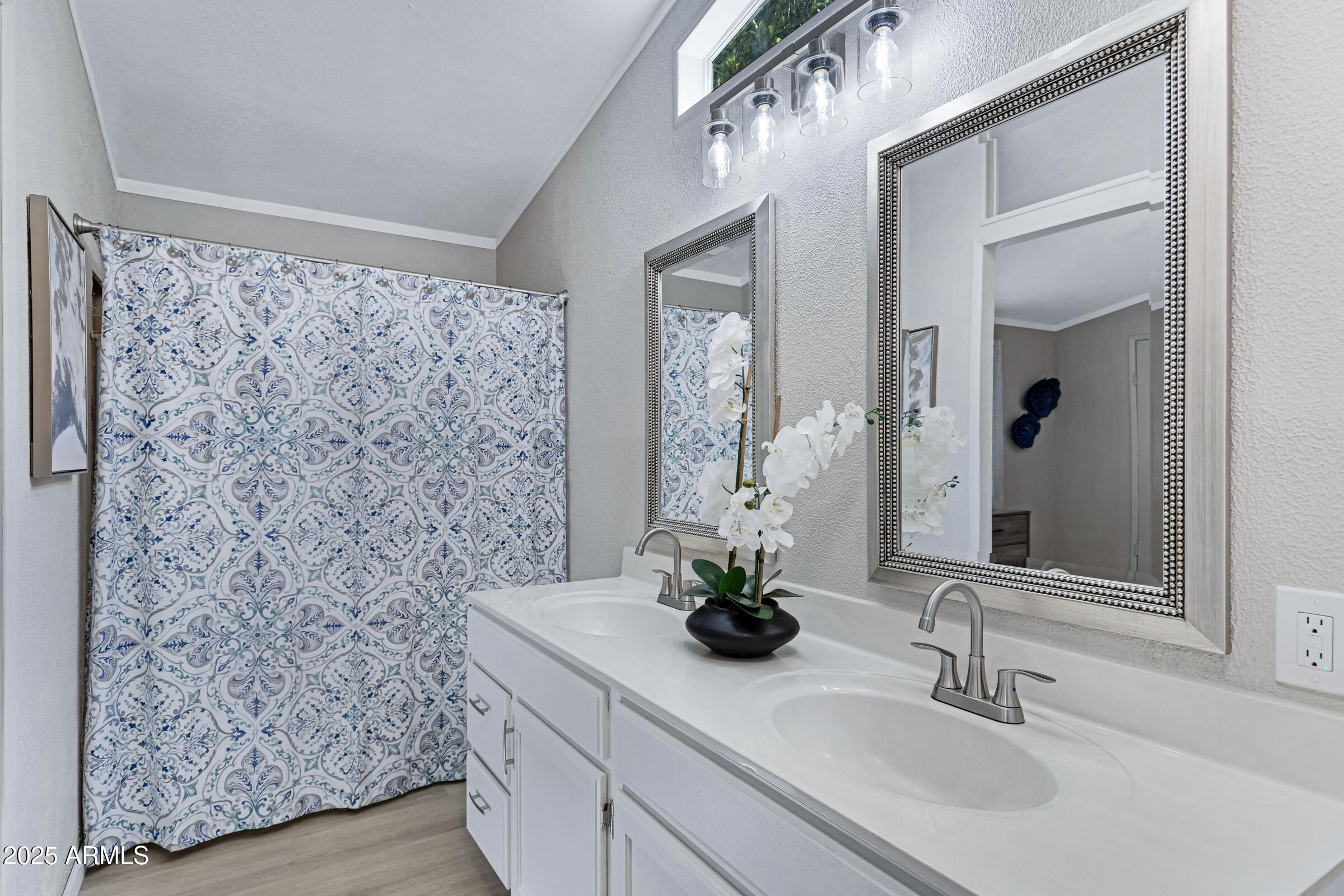 834 South Meridian Road, Unit 156 Apache Junction, AZ 85120 - Photo 12 of 20 a bathroom with a sink and a mirror