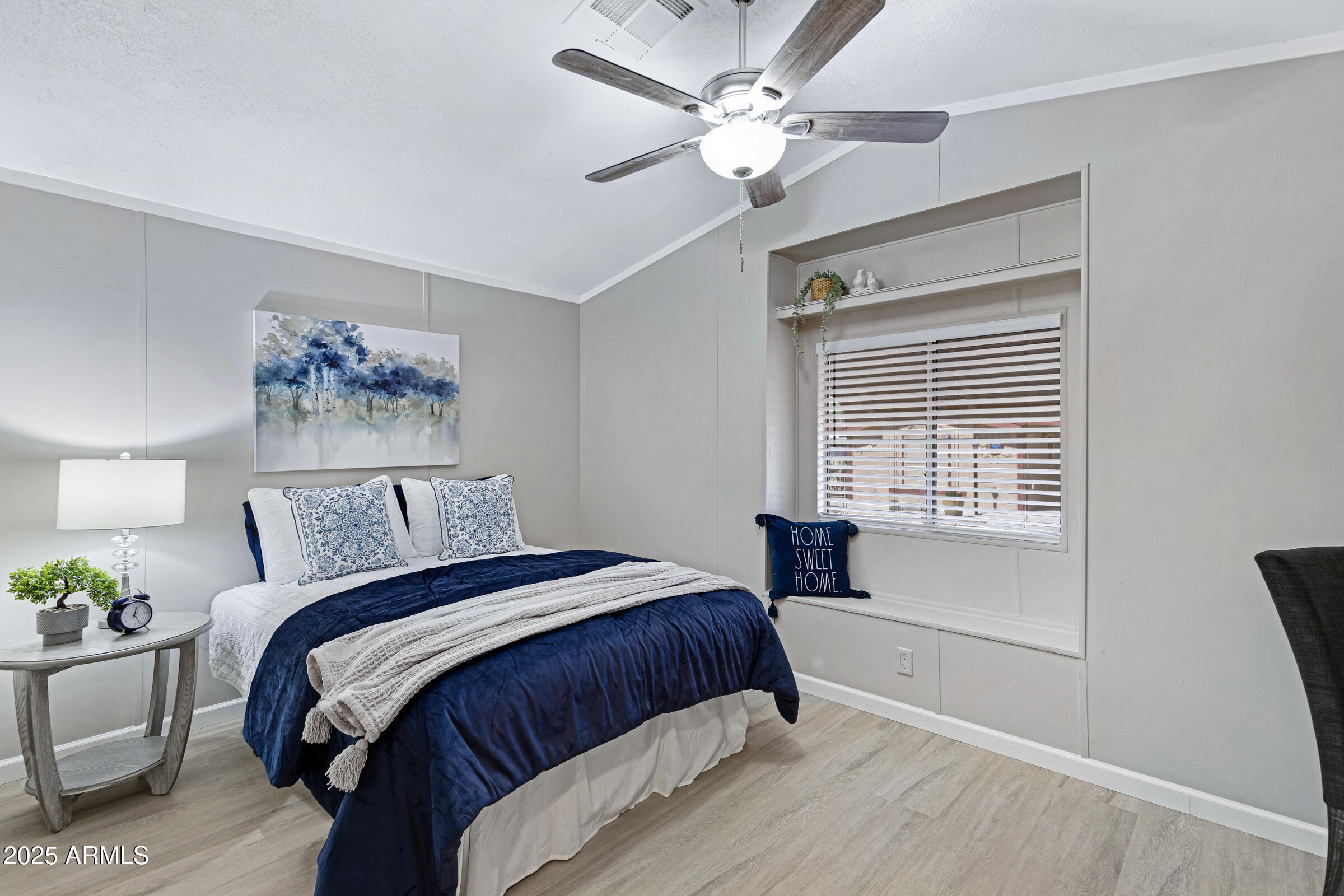 834 South Meridian Road, Unit 156 Apache Junction, AZ 85120 - Photo 13 of 20 a bedroom with a large bed and a window