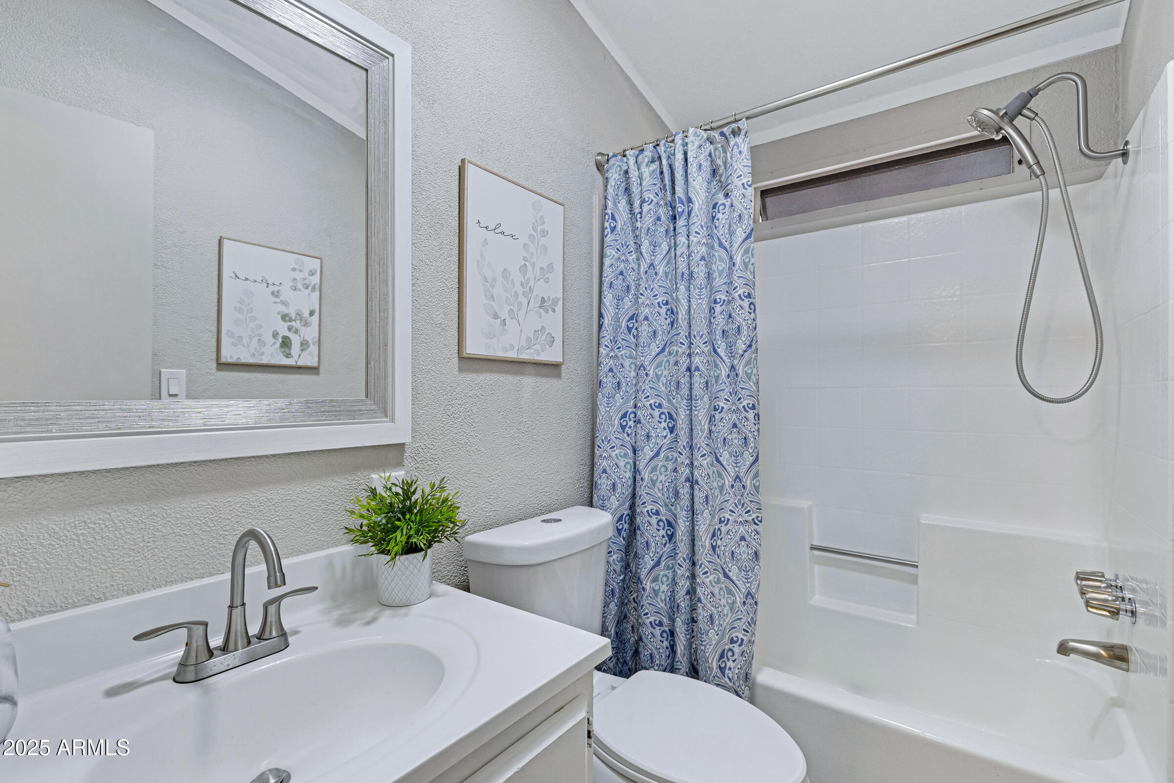 834 South Meridian Road, Unit 156 Apache Junction, AZ 85120 - Photo 15 of 20 a bathroom with a sink toilet and shower