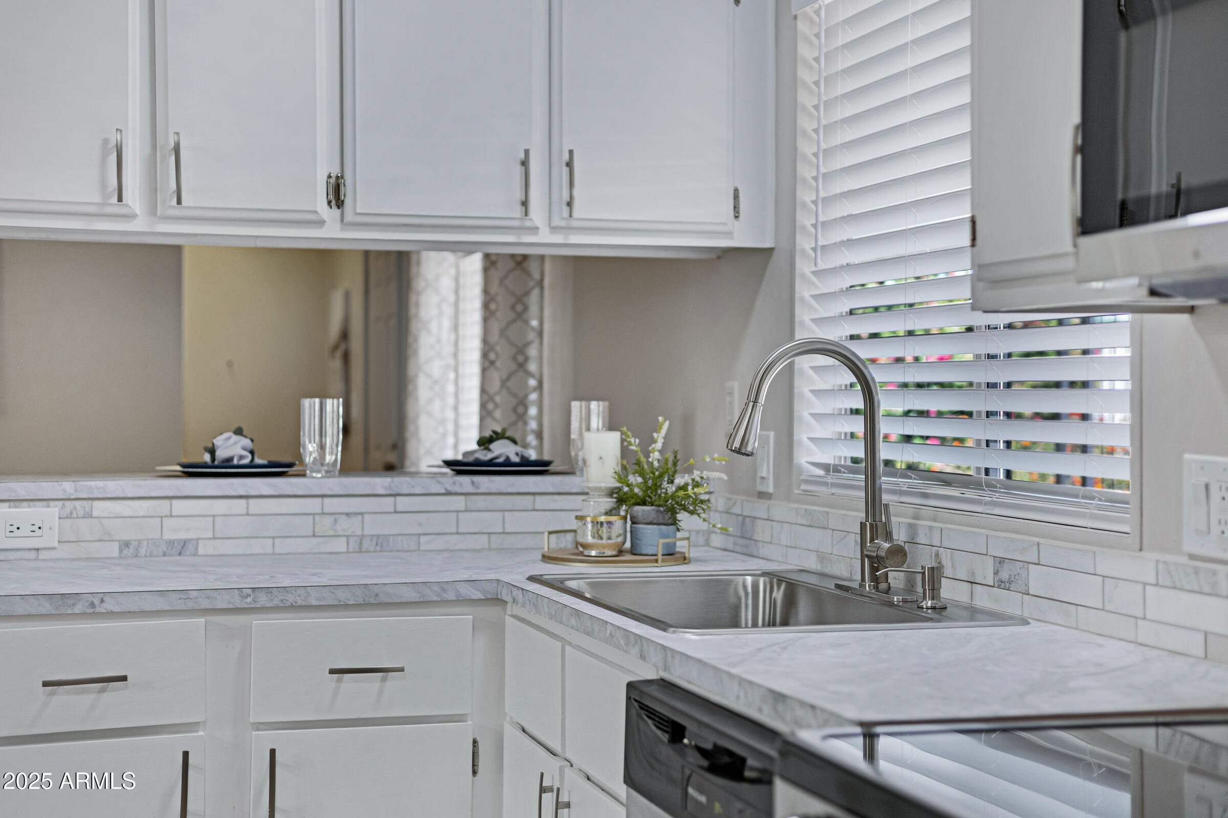 834 South Meridian Road, Unit 156 Apache Junction, AZ 85120 - Photo 4 of 20 a kitchen with a sink and cabinets