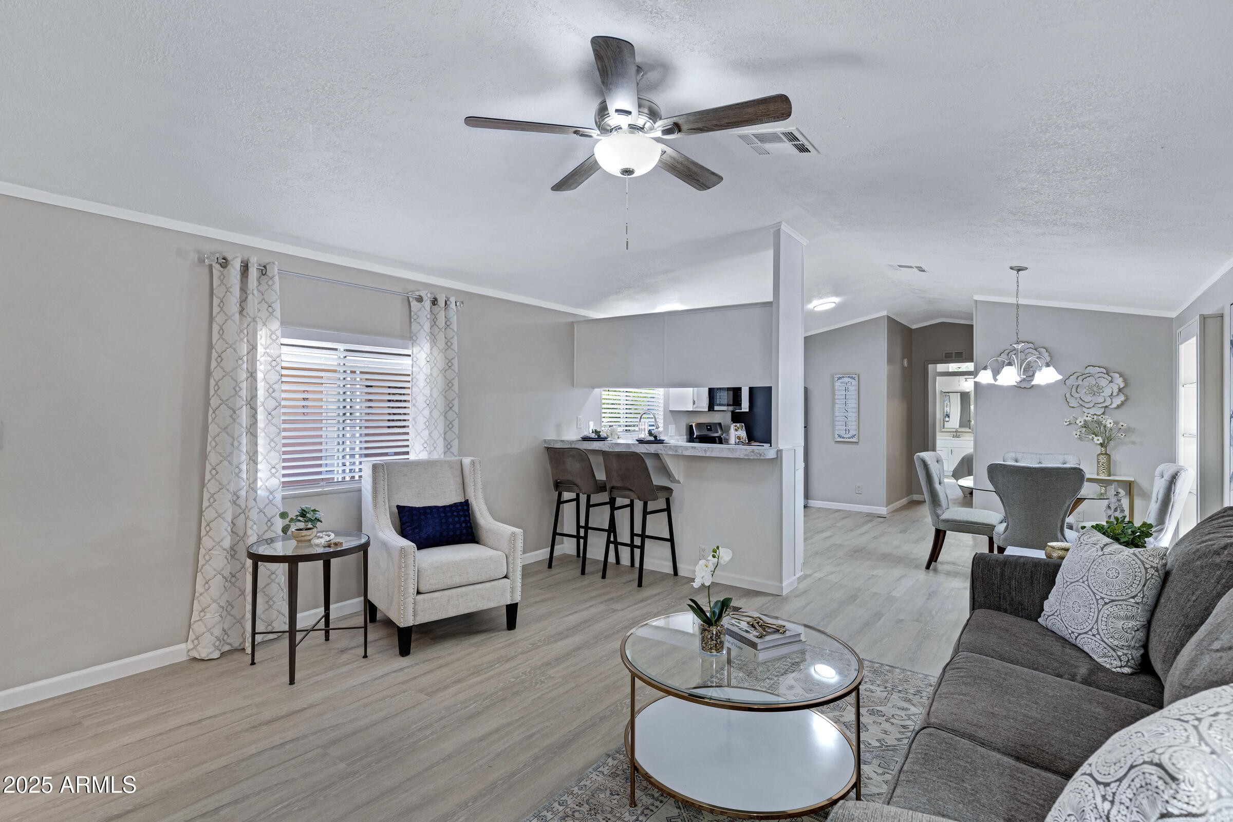 834 South Meridian Road, Unit 156 Apache Junction, AZ 85120 - Photo 8 of 20 a living room with furniture and a large window