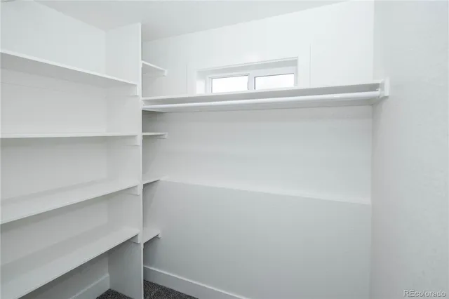 a bathroom with a double vanity sink and a toilet