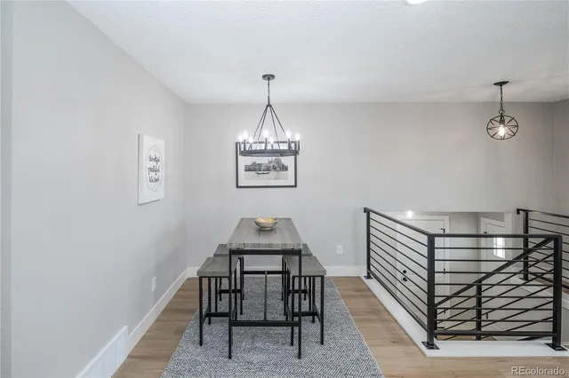 a view of dining room and hall with wooden floor