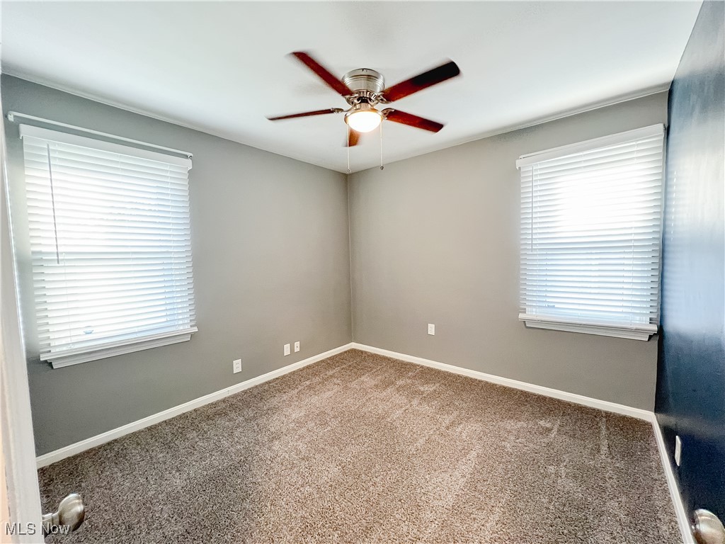 6403 Kenneth Avenue Parma, OH 44129 - Photo 12 of 20 Carpeted bedroom room with baseboards and a ceiling fan