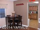 250 North Grey Road Grandview, WA 98930 - Photo 3 of 8 a room with a table and chairs