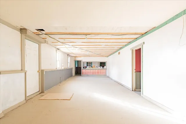 a big room with closet and windows