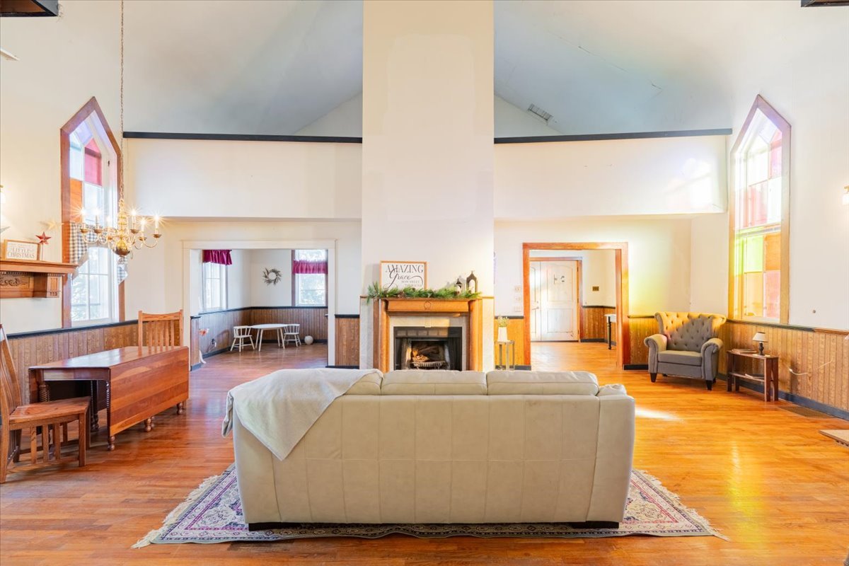 269 Chicago Street Dewitt, IL 61735 - Photo 8 of 34 a living room with furniture and a fireplace