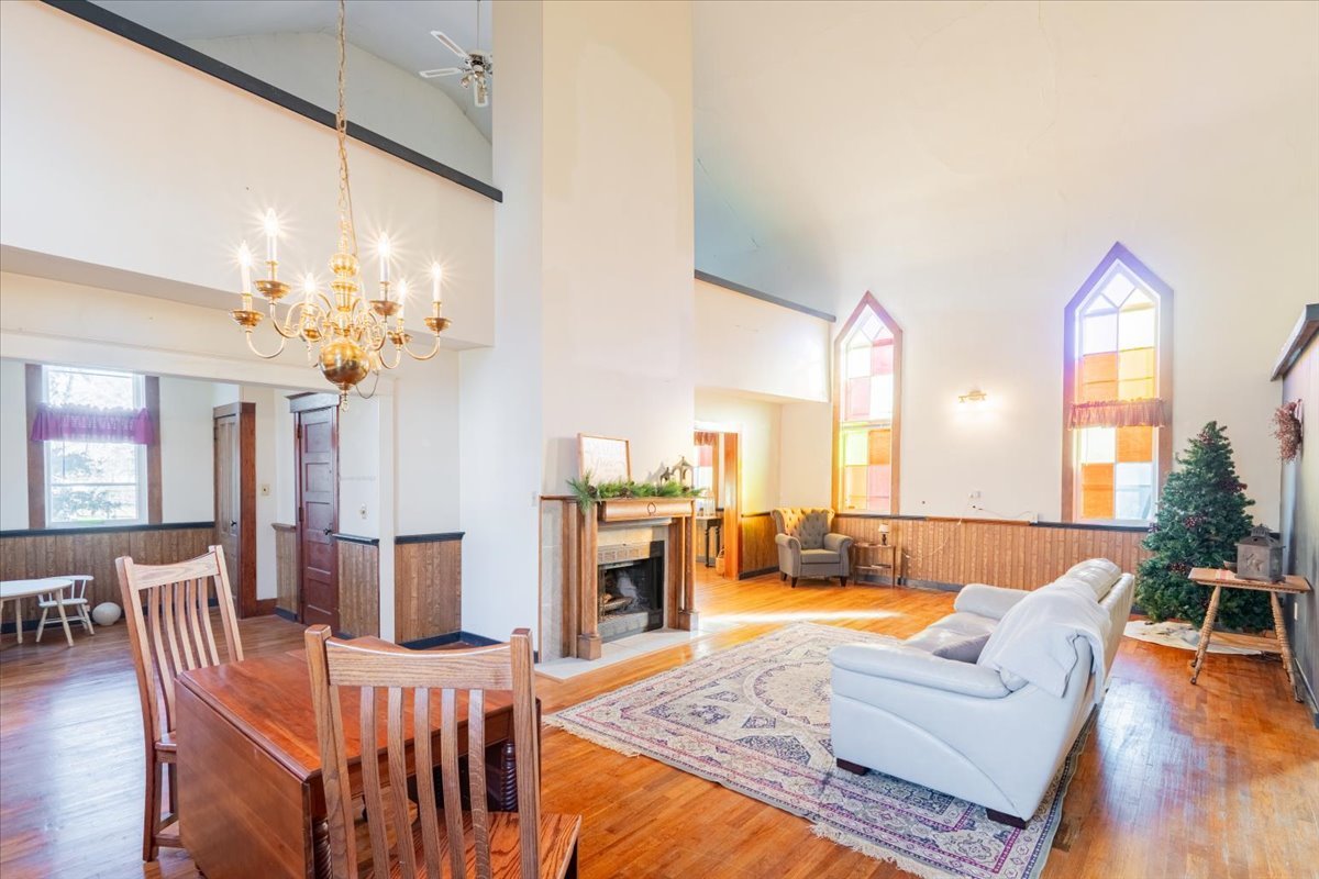 269 Chicago Street Dewitt, IL 61735 - Photo 10 of 34 a living room with furniture dining table and a chandelier
