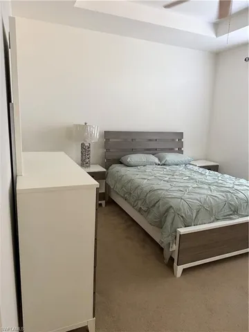 a bedroom with a bed and a table in it