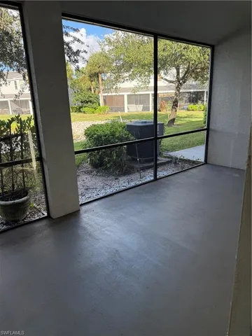a view of a room with furniture and a fireplace